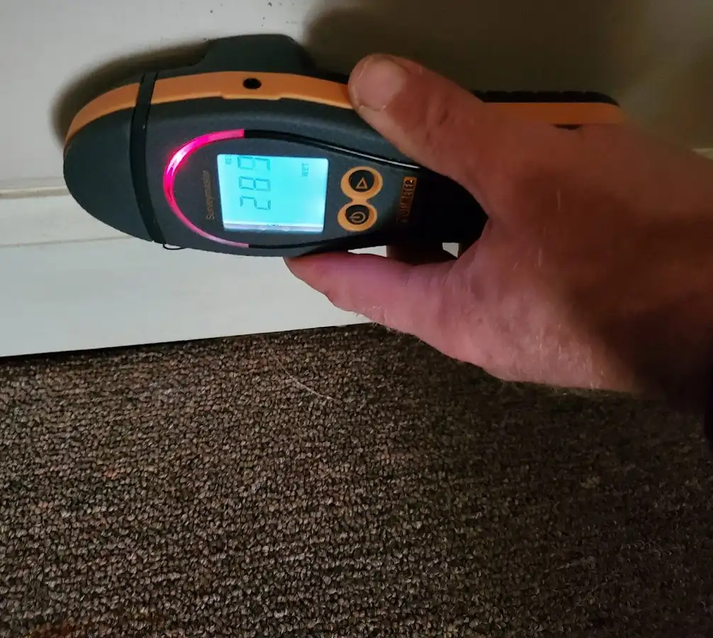 Moisture detection at baseboard during Storm Damage Restoration in Russellville